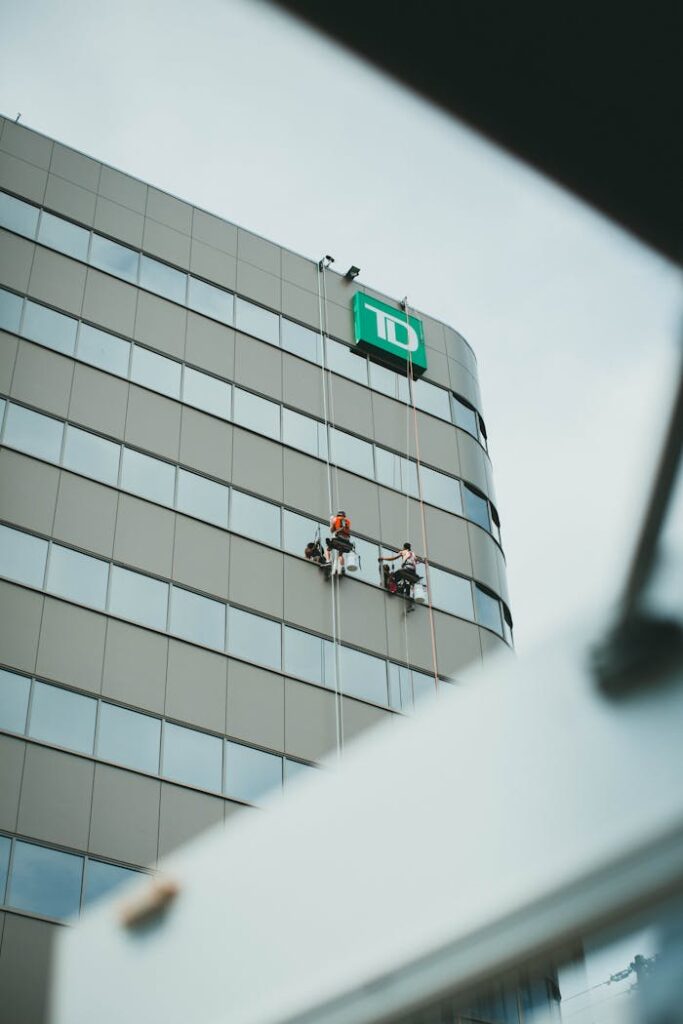 People Cleaning Building Windows